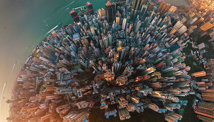 Little planet. Aerial view of Hong Kong Downtown. Financial district and business centers in smart city in Asia. Top view. Panorama of skyscraper and high-rise buildings.