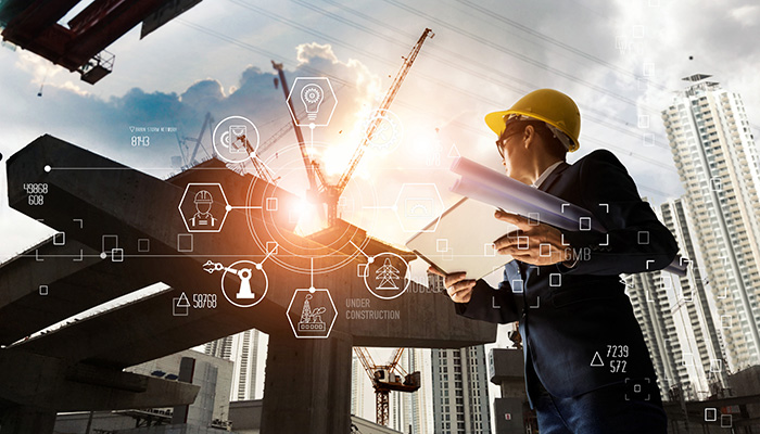 A futuristic architect, Businessman, Industry 4.0. Engineer manager using tablet with icon network connection in construction site, Industrial and innovation. Industry technology concept.