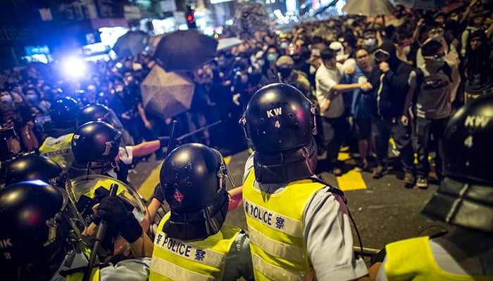 Hong Kong, China: Riot police disperse protesters with baton at the occupied area in Mongkok district.