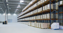 interior of a warehouse - shelves full of boxes of merchandise
