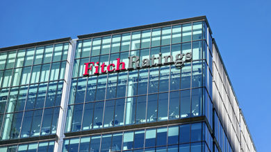 London, United Kingdom - February 03, 2019: Fitch Ratings logo signage at top of their Headquarters in UK (other is in New York), Canary Wharf. FR is one of the Big Three credit rating agencies