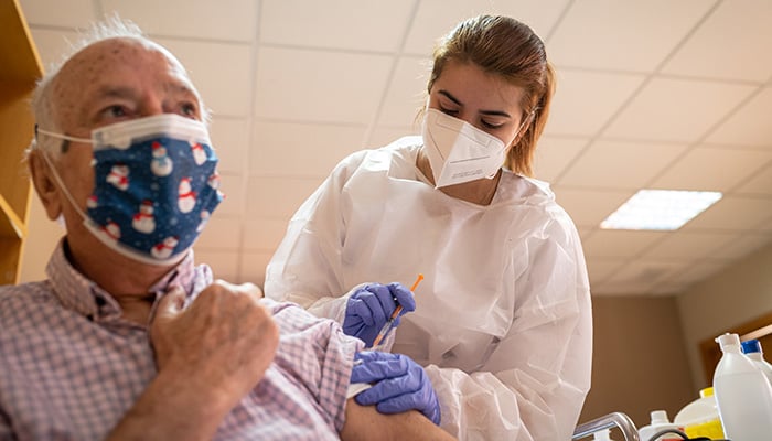 Covid-19 vaccine being administered in Madrid, Spain. Credit: Shutterstock/FernandoV