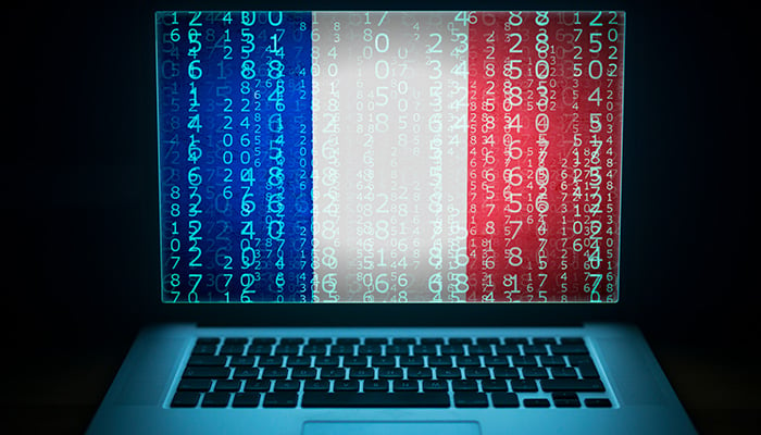 France security system. Laptop with French flag, code and digits on the screen. Internet and network hacking protection concept.