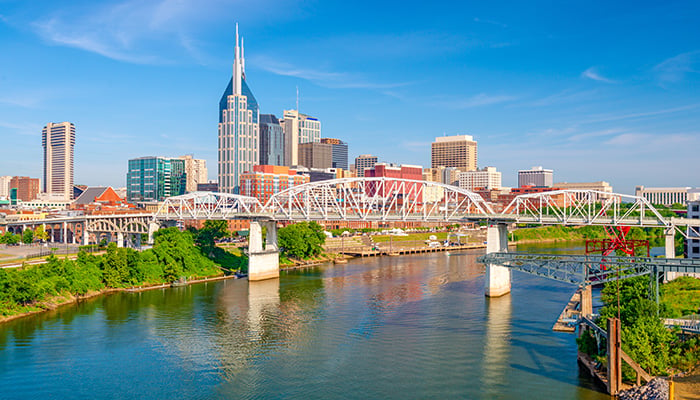 Nashville, Tennessee, USA downtown city skyline on the Cumberland River.