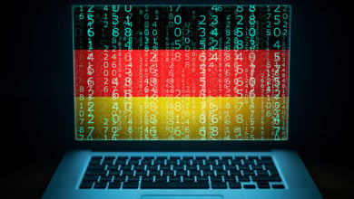 Germany security system. Laptop with German flag, code and digits on the screen. Internet and network hacking protection concept.