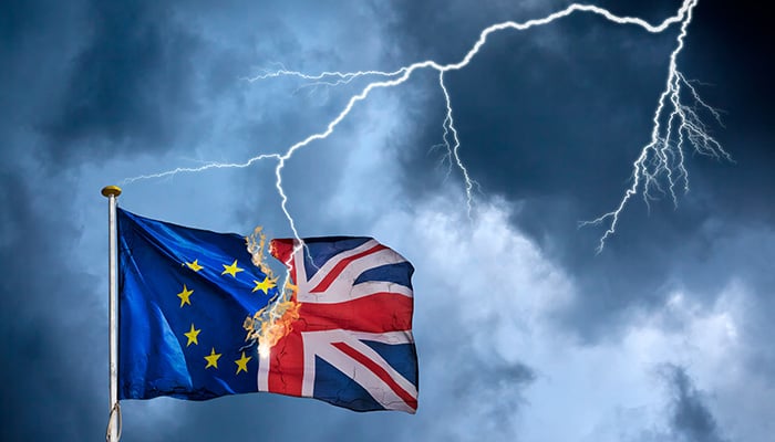 Concept of the British Brexit with the English flag struck by lightning in a heavy storm