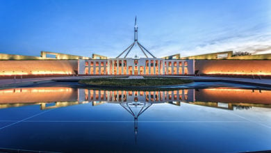 Canberra, Australia- April 14, 2016: Dramatic evening sky over Parliament House, illuminated at twilight. Which was the world's most expensive building when it was completed in 1988.