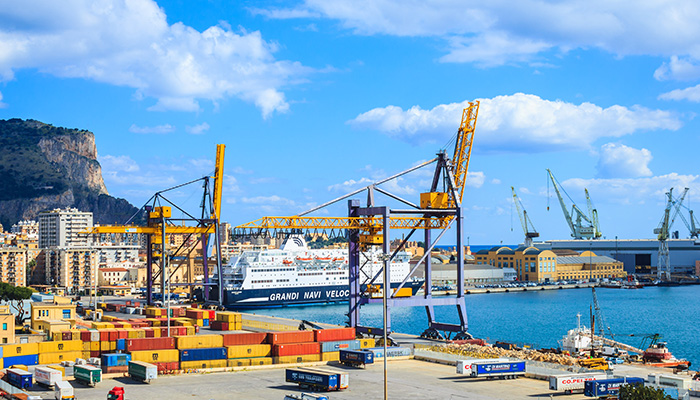 PALERMO, SICILY, ITALY- APRIL 8: View of port with cranes, containers and city of Palermo in Sicily, Italy on April 8, 2015.