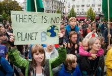 Oslo, Norway - September 21, 2014: A sign reads, "There Is No Planet B", as parents carry children among thousands marching through central Oslo, Norway, to support action on global climate change, September 21, 2014. According to organizers of "The People's Climate March", the Oslo demonstration was one of 2,808 solidarity events in 166 countries, which they claim was "the largest climate march in history".