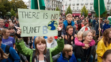 Oslo, Norway - September 21, 2014: A sign reads, "There Is No Planet B", as parents carry children among thousands marching through central Oslo, Norway, to support action on global climate change, September 21, 2014. According to organizers of "The People's Climate March", the Oslo demonstration was one of 2,808 solidarity events in 166 countries, which they claim was "the largest climate march in history".