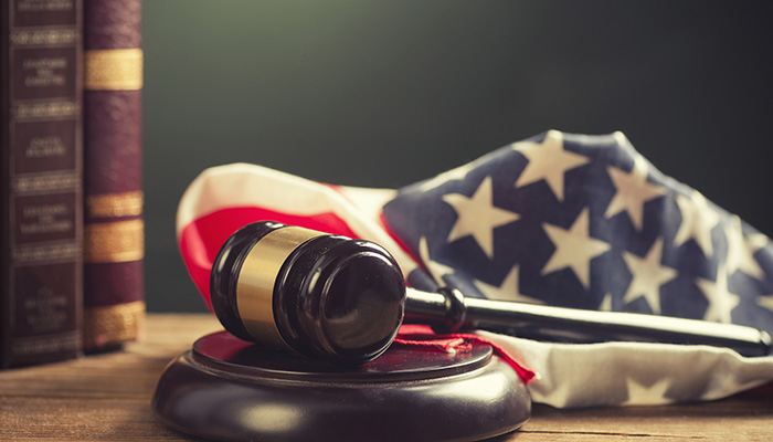 Wooden Gavel with American Flag on a wooden table