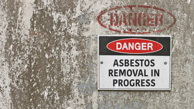 red, black and white Danger, Asbestos Removal in Progress warning sign
