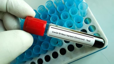 Researcher hold blood sample for New Variant of the Covid-19 Omicron B.1.1.529 test. A generic of covid-19 Coronavirus Mutations. Doctor in analysis lab holding sample of new strain of covid Omicron
