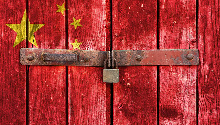 China flag on the background of old locked doors
