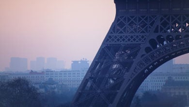 close up of Eiffel tower, pollution in Paris, France