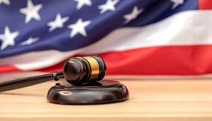 Wooden judge gavel USA flag as background, concept picture about justice in the USA
