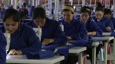 HOTAN, CHINA - APRIL 27 2019. Uigur women work in a cloth factory in Hotan county, Xinjiang province, China.