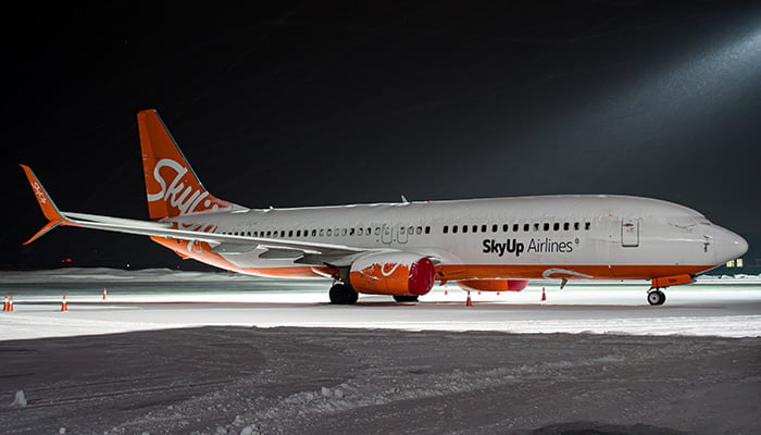 Lviv, Ukraine - February 15th, 2021: Snowy SkyUp Airlines Boeing 737-800 standing at apron in Lviv Airport. High-quality photo