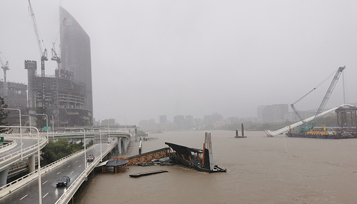 BRISBANE, AUSTRALIA - FEBRUARY 27, 2022: Wild weather and heavy rain falls from Tropical Cyclone storm Brisbane Central Business District. The North Quay ferry terminal is flooded and closed. Brisbane