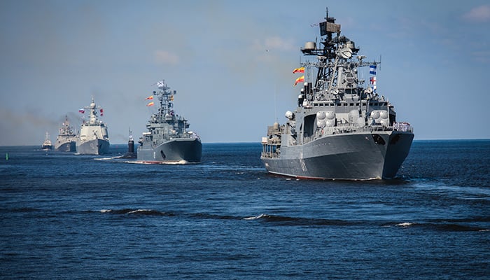 A line ahead of modern russian military naval battleships warships in the row, northern fleet and black sea fleet, summer sunny day