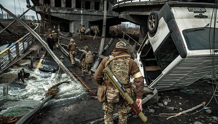 Irpin, Ukraine -March 5, 2022: War in Ukraine. Ukrainian civilians flee as Russian shelling intensifies in Ukrainian city of Irpin.