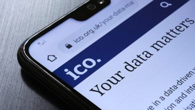 Stafford / United Kingdom - October 27, 2020: The Information Commissioner's Office ICO website seen on the smartphone corner. The United kingdom watchdog protects information rights, data privacy.