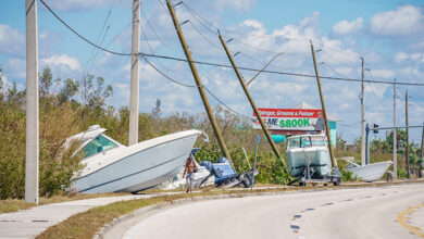 Fort Myers, FL, USA - October 1, 2022: Boats laying on the side of the road in Fort Myers FL Hurricane Ian aftermath