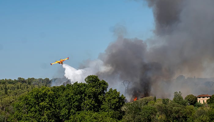 Aubais, gard, France - July 31, 2022: Fire in the scrubland on the road between Aubais and Gallargues-le-Montueux. Intervention of firefighters and dash.