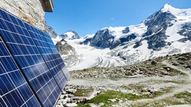 Close-up perspective snapshot of solar modules installed on the walls of alpine hut in Swiss Alps as alternative source of energy, concept of alternative energy