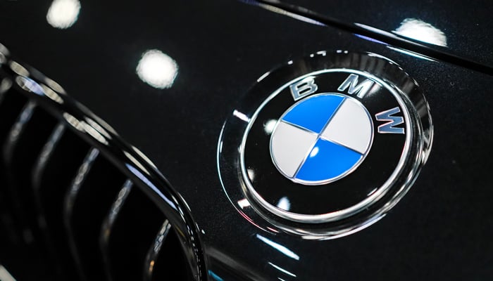 Close up of a BMW logo badge on a dark-coloured car