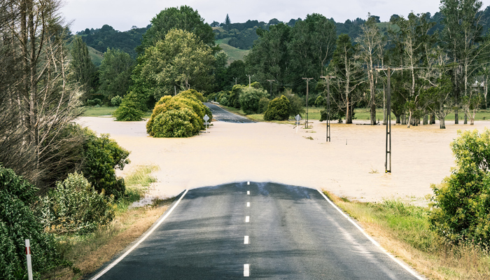 Flooded rural road during Cyclone Gabrielle, Aukland, New Zealand