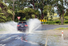 Car on flooded road after cyclone Gabrielle, February 2023, Auckland, New Zealand