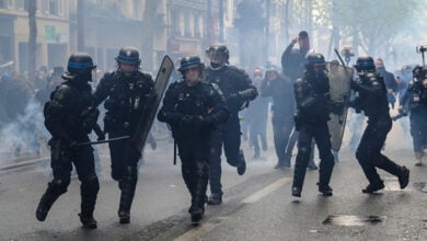 Riot police uses tear gas to disperse the crowd during the May Day labour march, a day of mobilisation against the French pension reform law and for social justice, in Paris, France May 1, 2023.